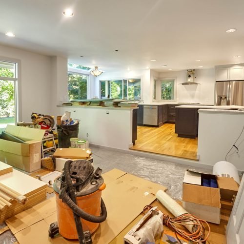 Shelves, circular saw, doors and other remodeling tools and supplies fill the family room as the kitchen is worked on